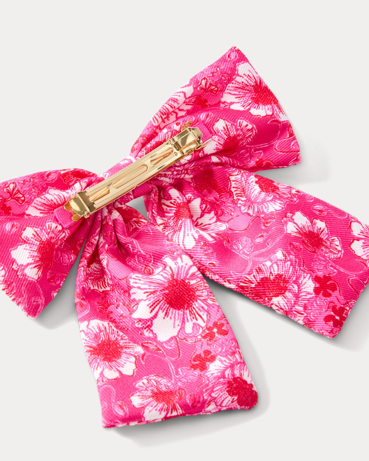 Lilly Pulitzer Embellished Bow Barrette in cranberry red with Feel design, featuring decorative embellishments and a stylish hair accessory.