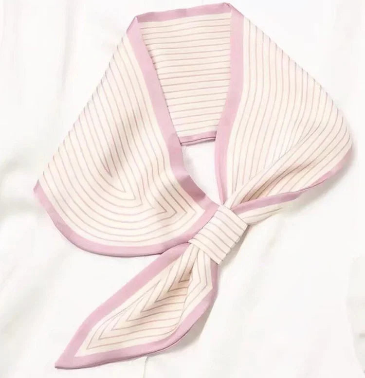 Winding River striped loop scarf with vibrant pink, white, and navy patterns, cozy and stylish accessory for chilly days.