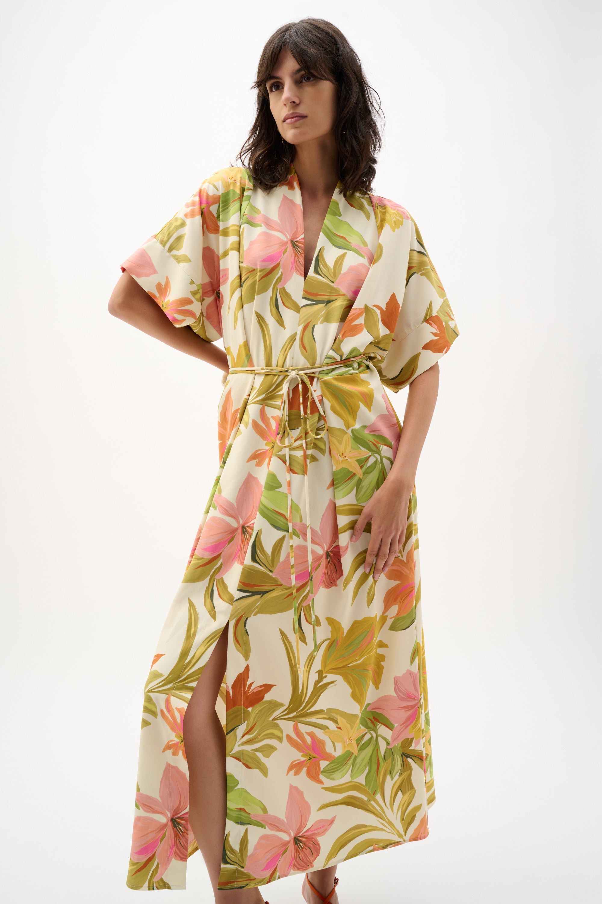 Joseph Ribkoff tropical print dress featuring vibrant floral and leaf patterns, sleeveless design, and flowy fabric.
