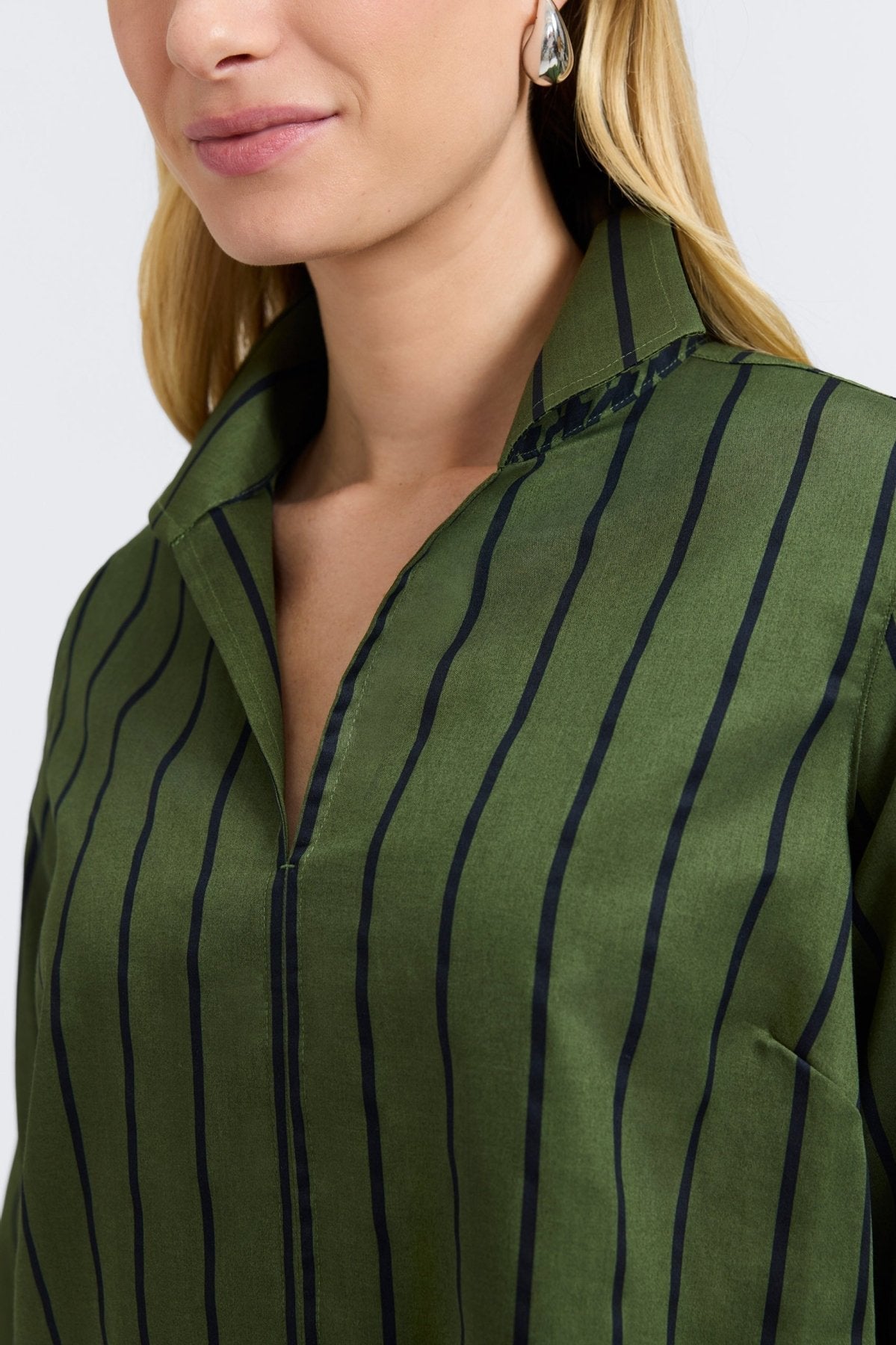 Green Agnes Top by FOXCROFT featuring a slim fit and vertical stripe pattern, displayed on a neutral background.