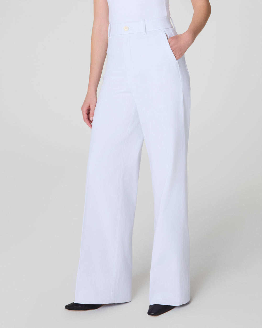 White Stretch Twill Wide Leg Pant by SPANX, featuring a relaxed fit and classic design, shown on a model.