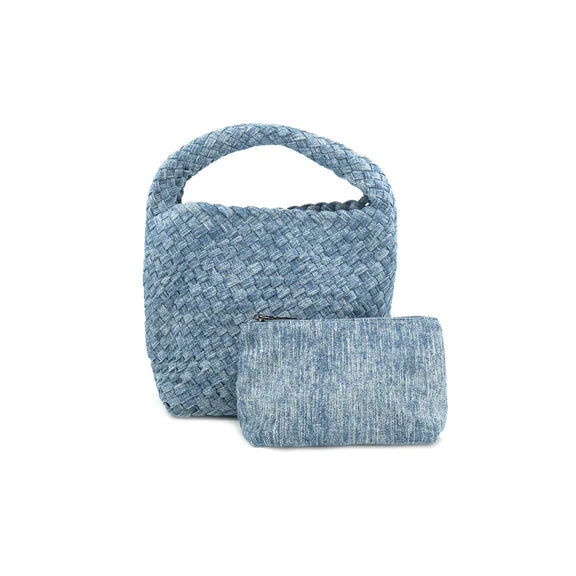 Light denim mini woven bag from BC HANDBAGS, stylish and compact handbag with woven texture and top handle.