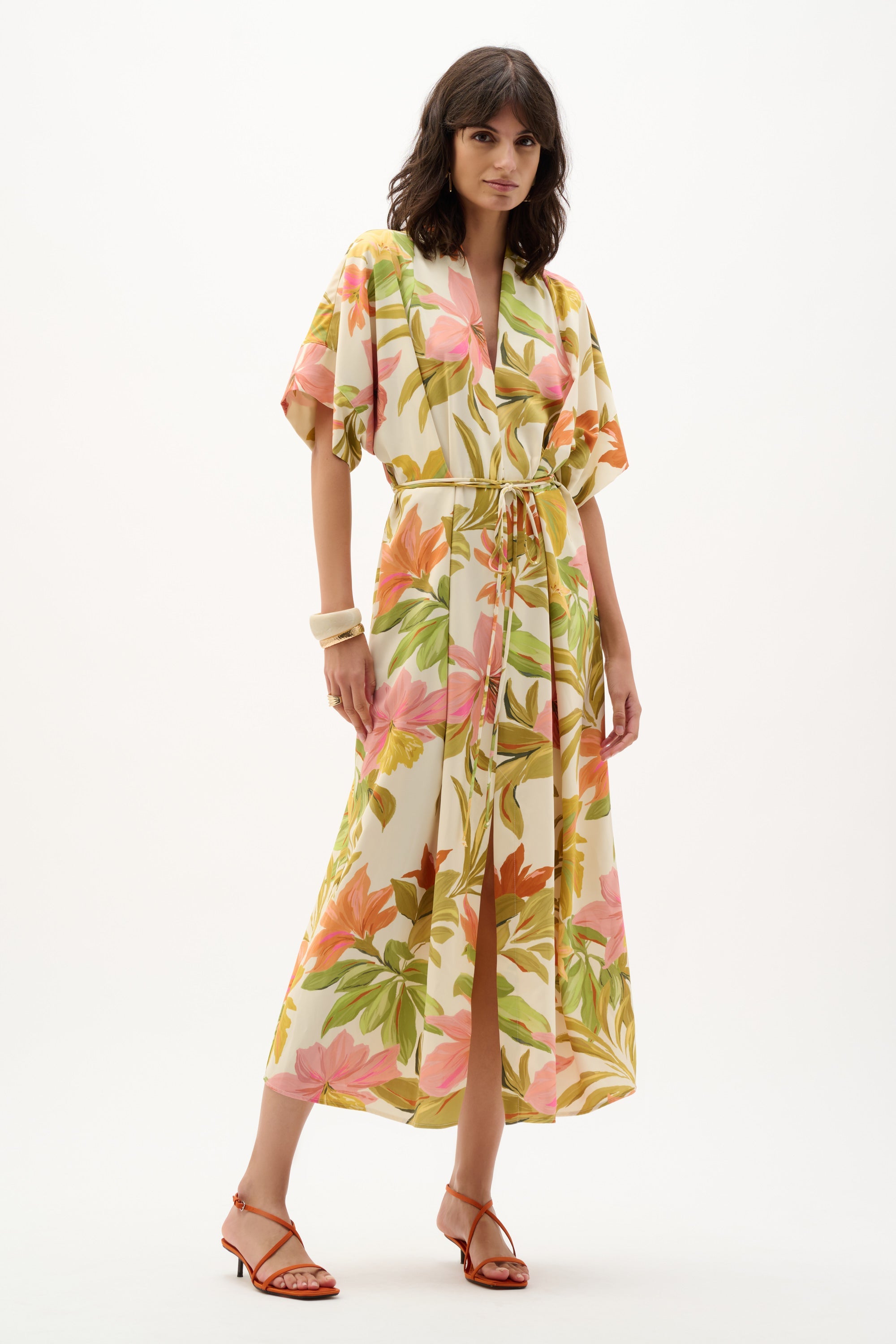 Joseph Ribkoff tropical print dress featuring vibrant floral patterns and a flowy silhouette, perfect for warm-weather wear.