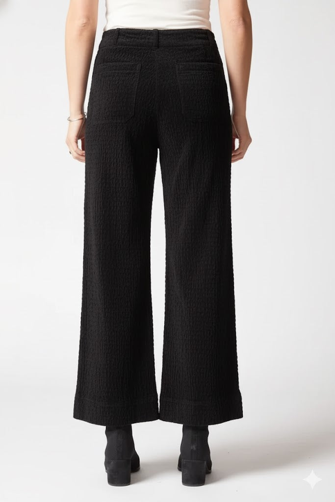 Habitat rustic stretch cord patch pants showing distressed fabric and patch details in a casual, rugged style.