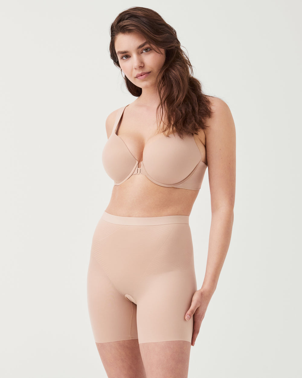 Spanx invisible girlshort lingerie shown in nude, seamless design with smooth fit and lightweight fabric for comfortable wear