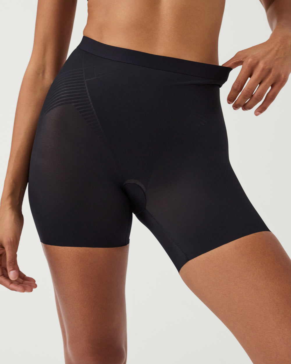 Spanx Invisible Girlshort lingerie, seamless nude shapewear with smooth finish, designed for discreet, comfortable support under clothing.
