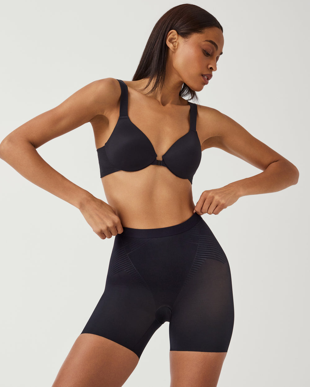 Spanx Invisible Girlshort lingerie in nude, seamless design with smooth fabric and high-waisted fit, ideal for discreet wear.