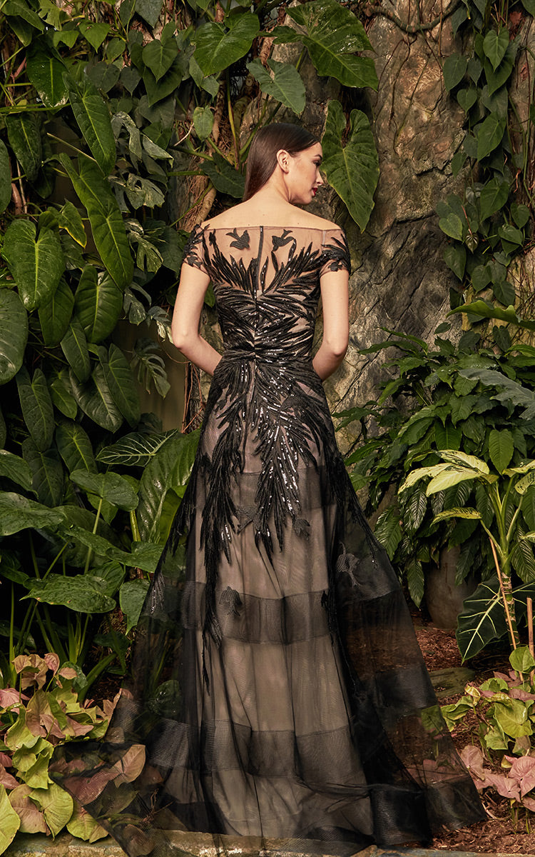 Black long dress by DAYMOR COUTURE featuring elegant fabric and a flowing silhouette, perfect for formal occasions.