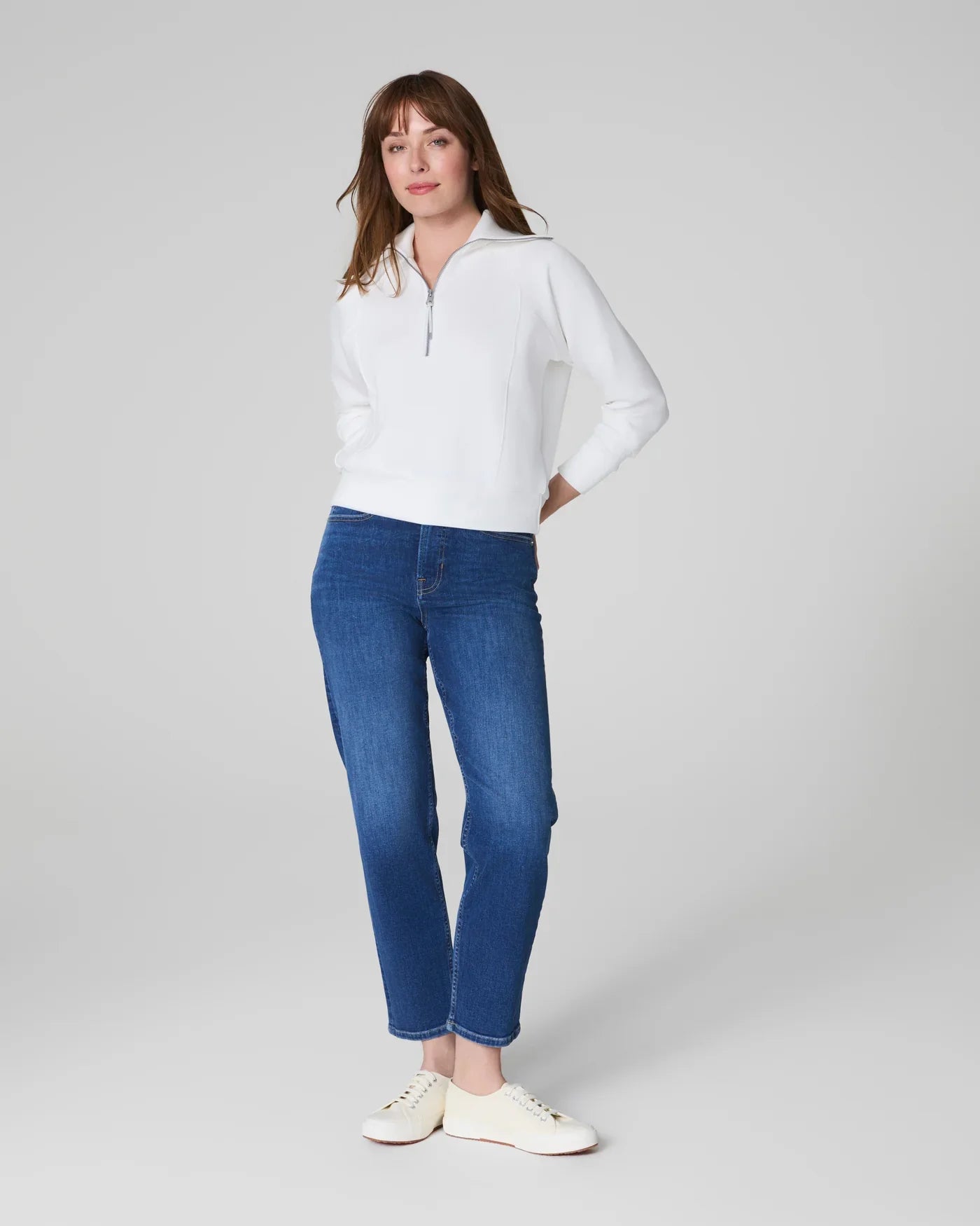 SPANKs Airessentials Half Zip Powder jacket showcased in a sleek, fitted design perfect for activewear and casual outfits.