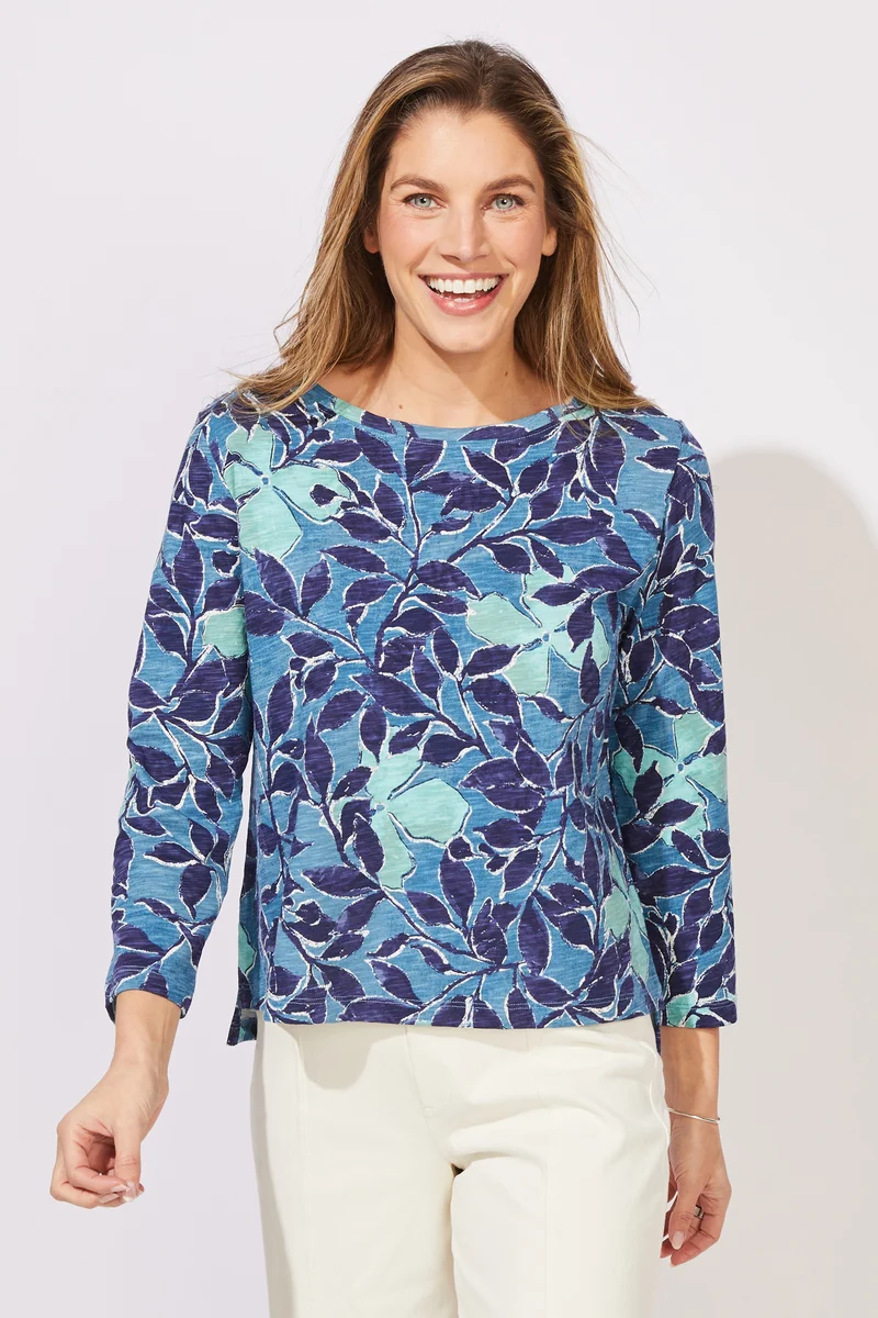 Woman wearing a blue floral patterned top ESCAPE BY HABITAT FOLIAGE FLORAL COTTON BOXY TEE - 12125 Color Harbor