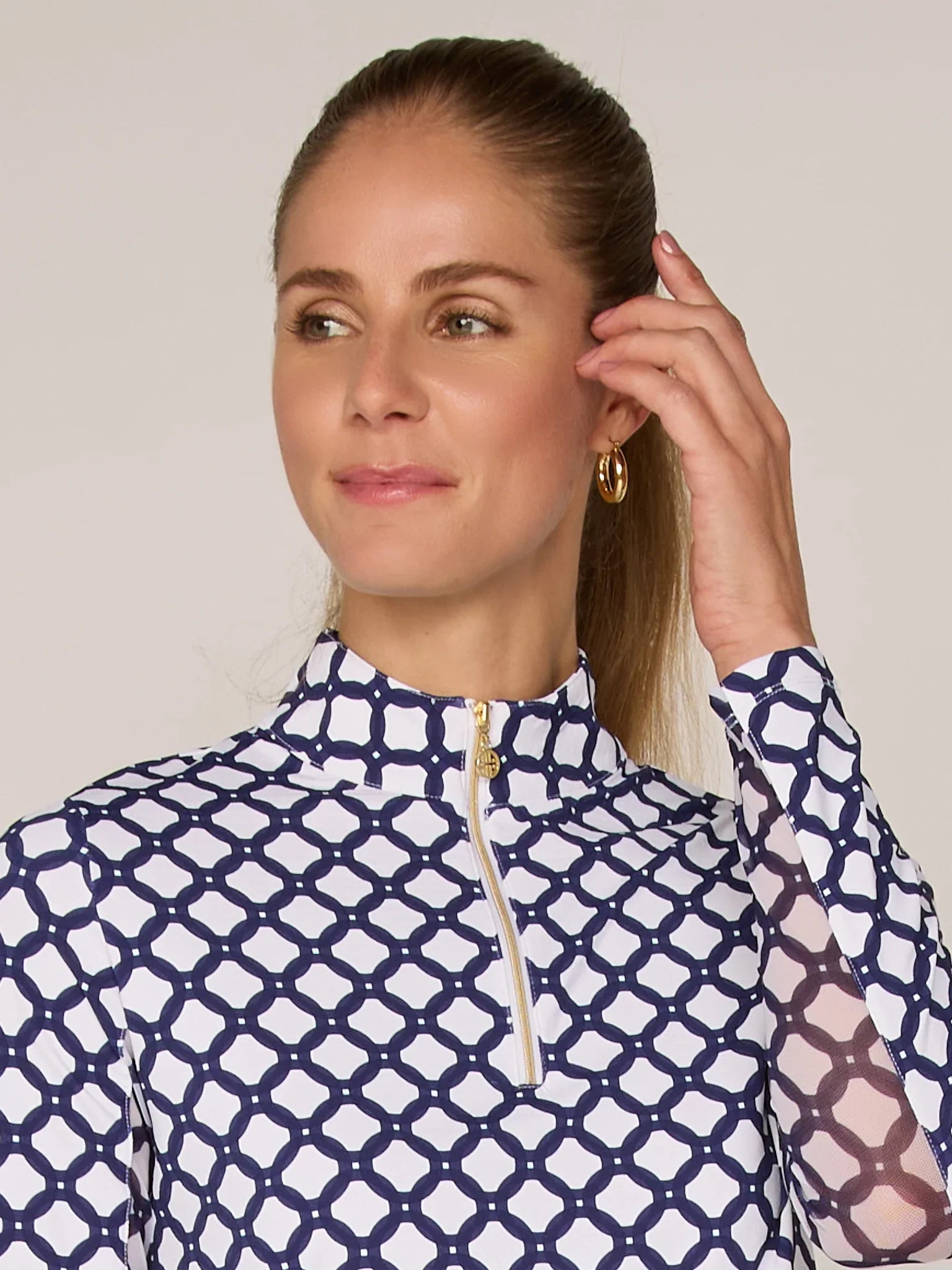 Women G Lifestyle Quarter Zip in navy and white patterned top with a gold zipper