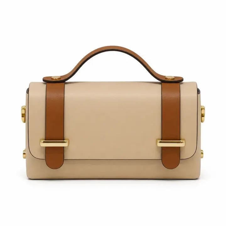 A structured beige leather handbag with a top handle, brown leather strap details, and gold-tone hardware by German Fuentes Handbags Top-Handle Crossbody Bag IVORY CAMEL