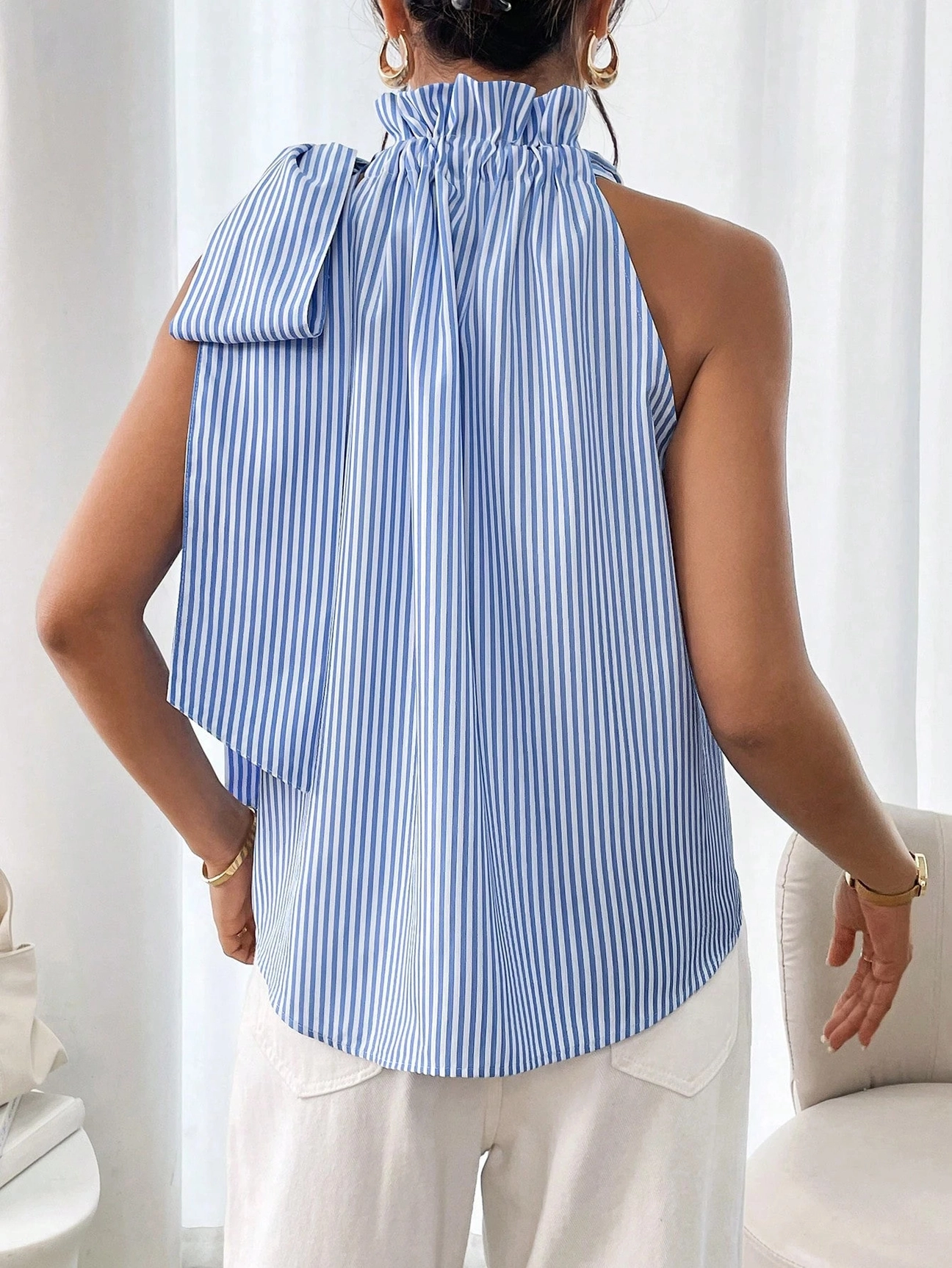 Women’s High-Neck Bow-Tied Sleeveless Shirt blue and white striped sleeveless top with a bow detail