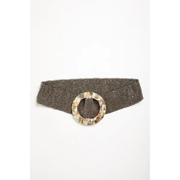 A wide waist belt featuring a textured, woven black and beige pattern with a large circular buckle made of natural mother-of-pearl shell pieces by Mare Sole Amore Silver Oz Slip On Stretch Belt