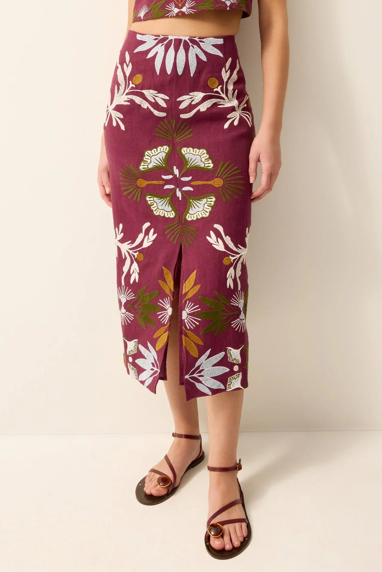 Marie Oliver Meara skirt in a flowing fabric, displayed on a hanger with a subtle pattern and neutral background.
