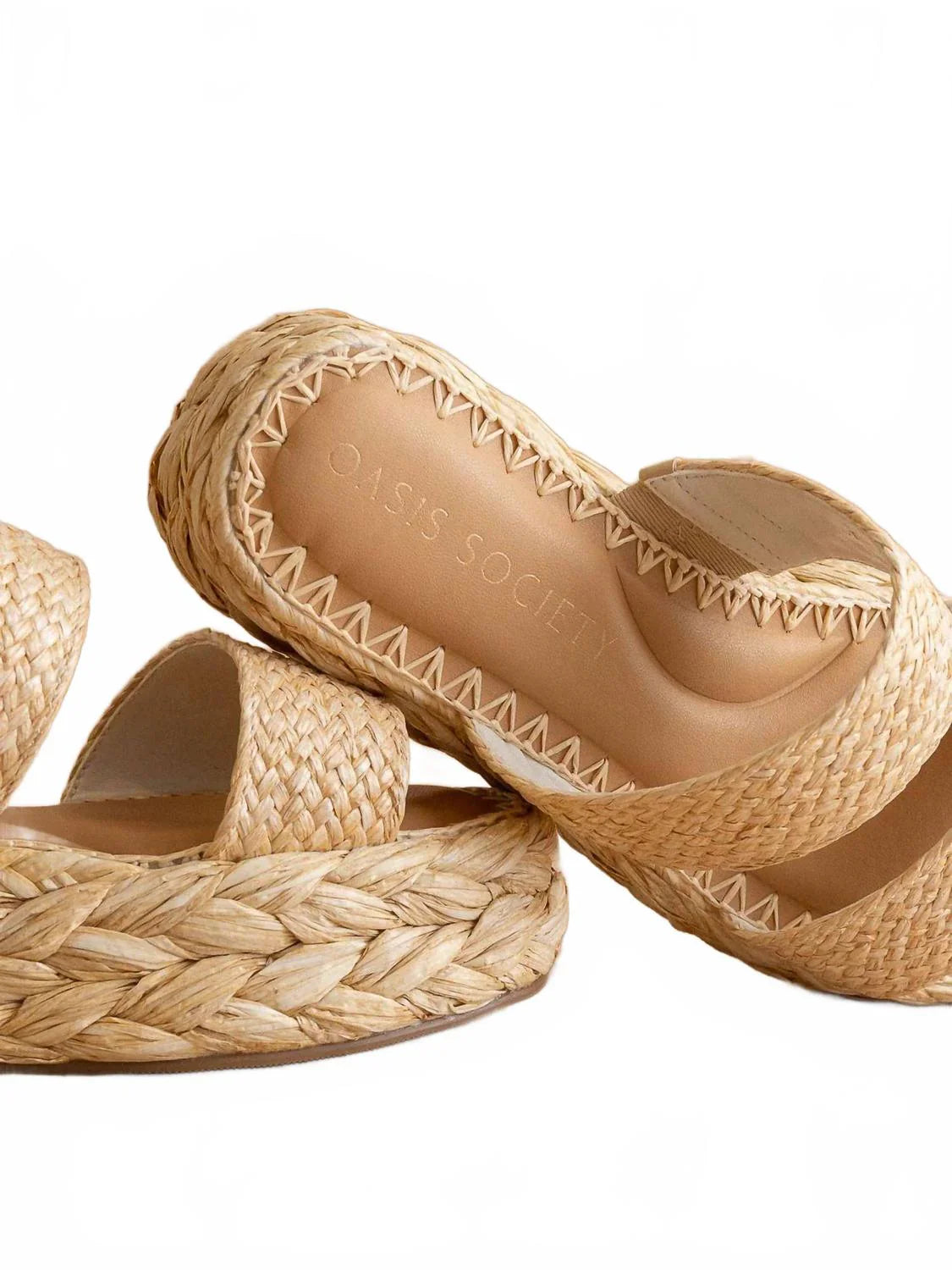 Pair of woven sandals on a white background