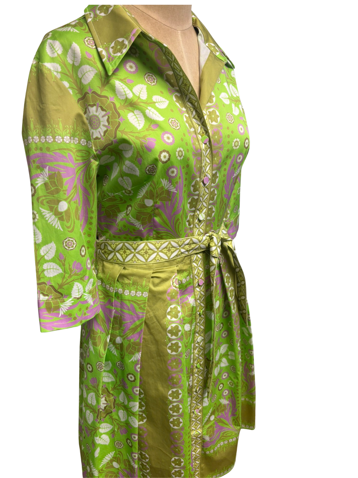 Green patterned shirt and pants set on a white background
