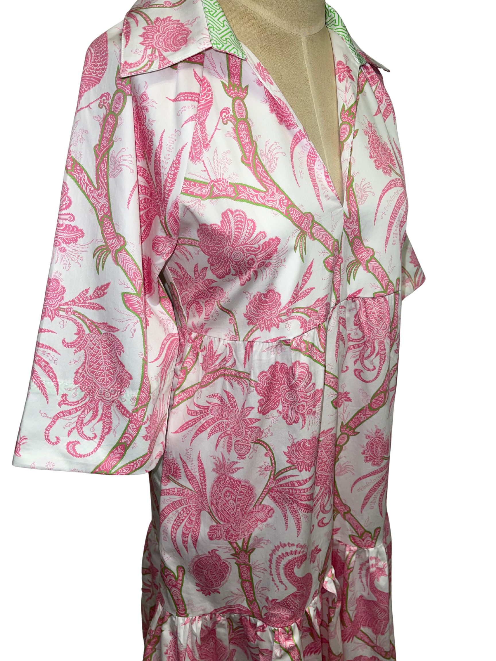 Floral patterned dress on a mannequin against a white background