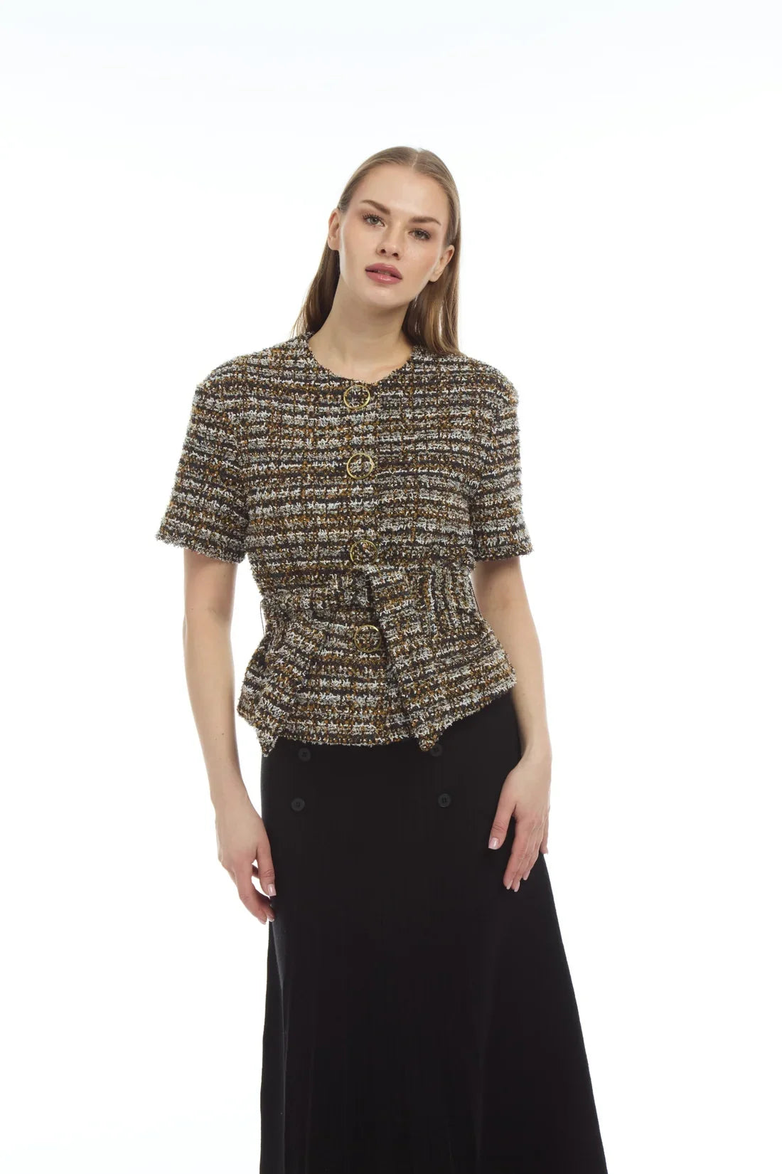 A woman modeling a short-sleeve tweed jacket with a button-up front and a matching tie waist