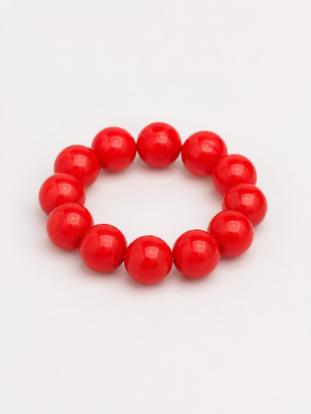 A beaded stretch bracelet made of glossy, round red beads. Uga, georgia football, university of Georgia game day jewelry.