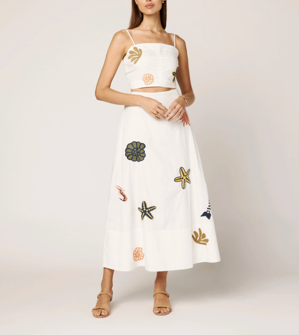 Clear image of a CLEOBELLA sage-colored skirt top with a stylish, fitted design, showcasing its fabric and neckline details.
