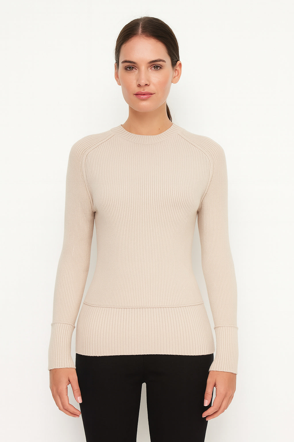 Woman wearing a beige sweater on a white background