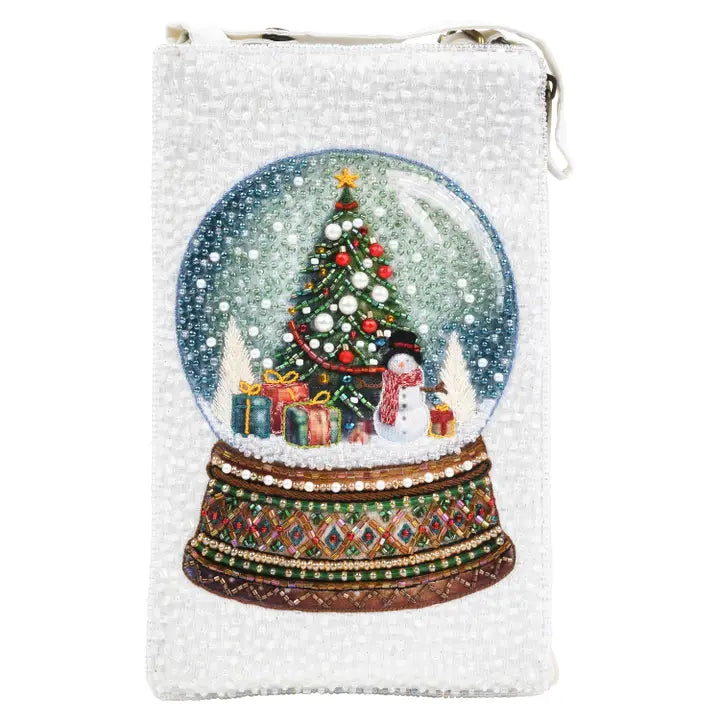 Snow globe design on a white pouch with a Christmas tree and snowman.