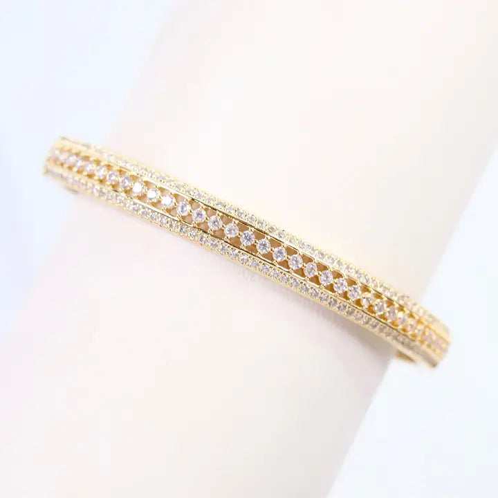 Gold bracelet with clear stones
