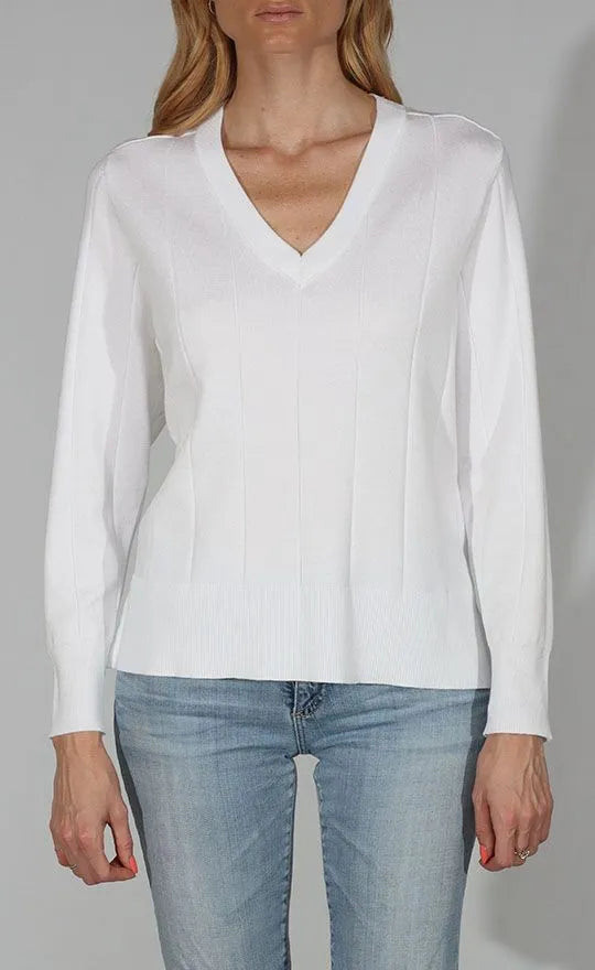 White V-neck top from Metric, casual sleeveless blouse with a smooth fabric and fitted silhouette.