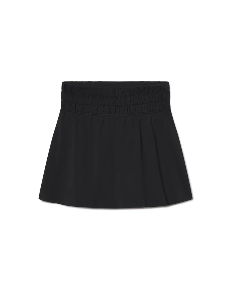 Black SPANX Air Essentials 14-inch skort with built-in shorts and a sleek, sporty design for active wear.