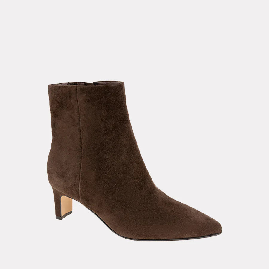 Brown suede ankle boot on a light gray background