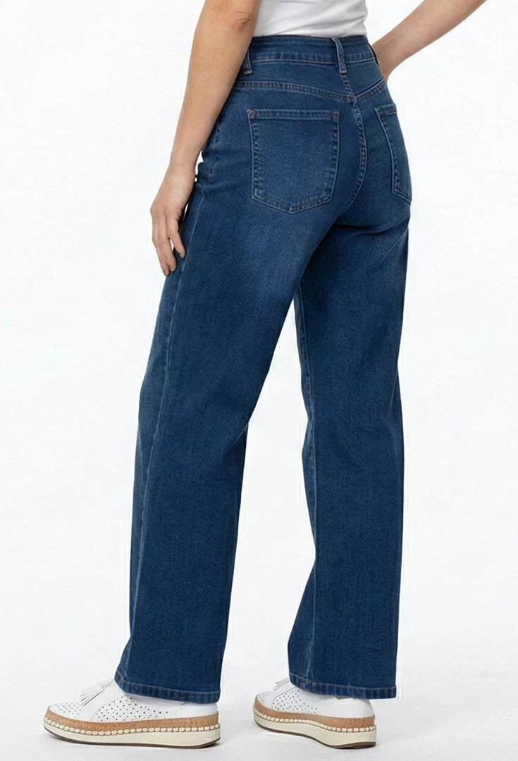 A person wearing dark blue wide-leg jeans, ethyl Relaxed Classic Jean - Benefit Z8MED.AF