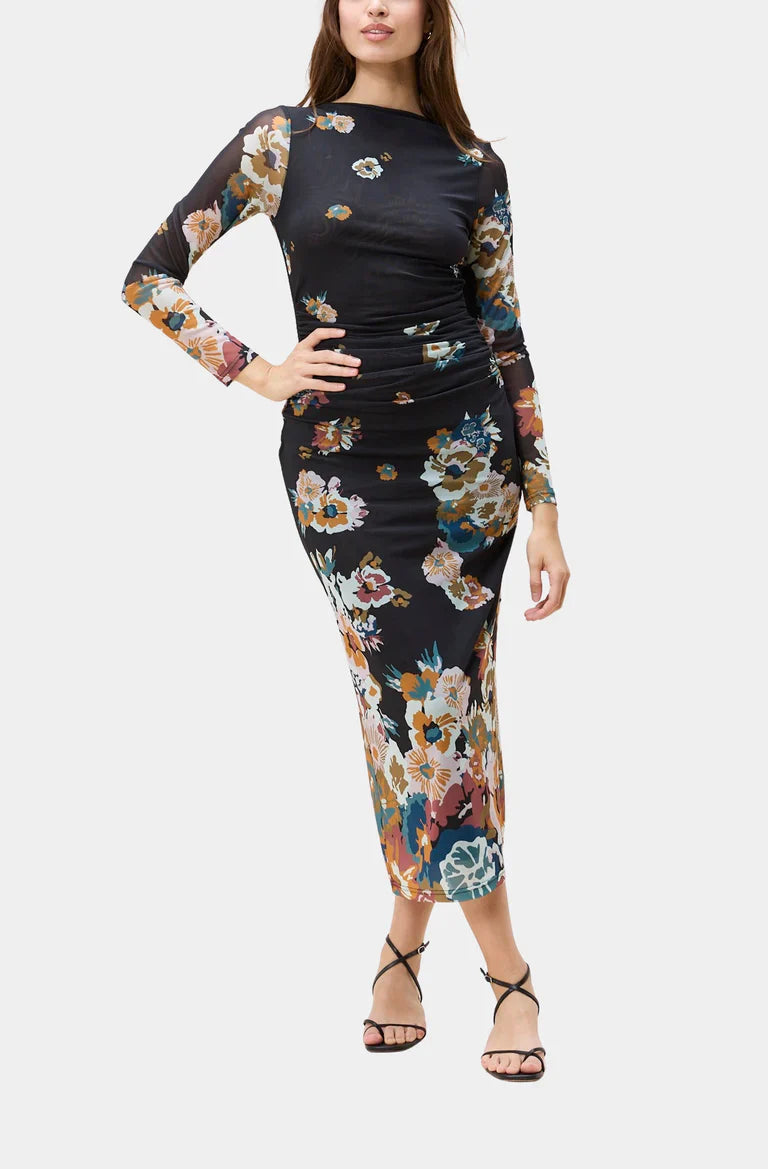 Woman wearing a black floral dress on a white background