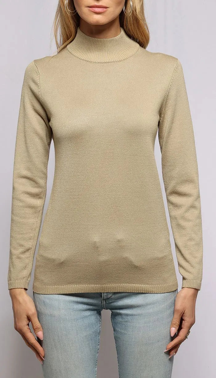 Beige turtleneck sweater worn by a person on a plain background