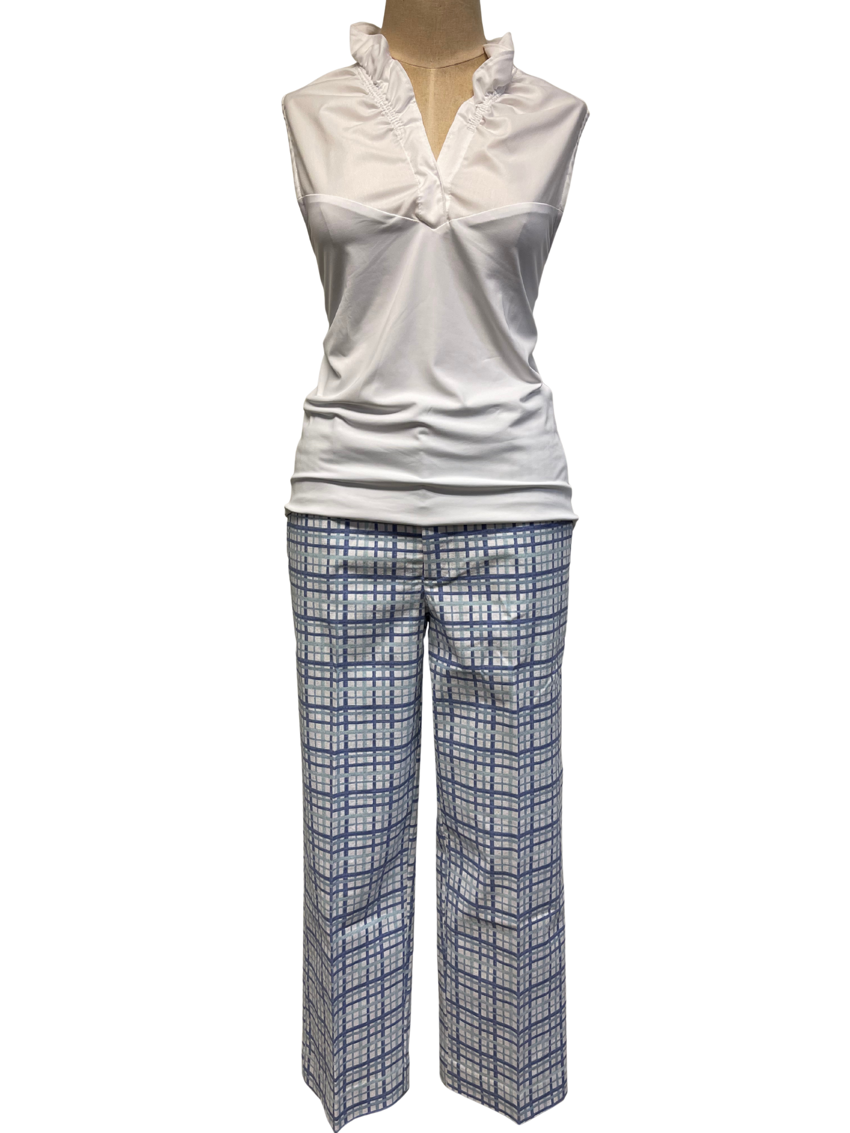 White sleeveless top and plaid pants on a mannequin against a white background