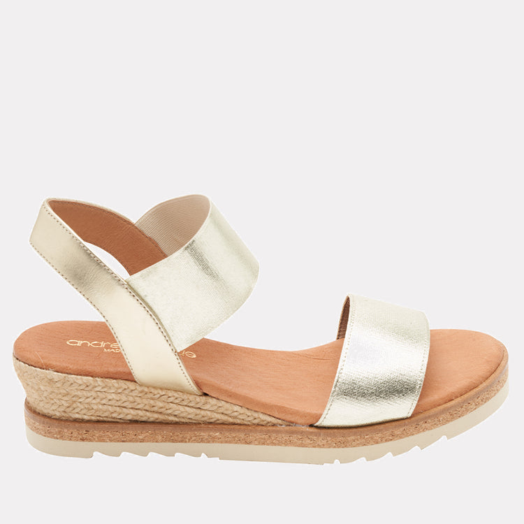 Andre Assous Neveah metallic wedge shoes with a sleek, shiny finish and stylish design, ideal for casual or dressy occasions.