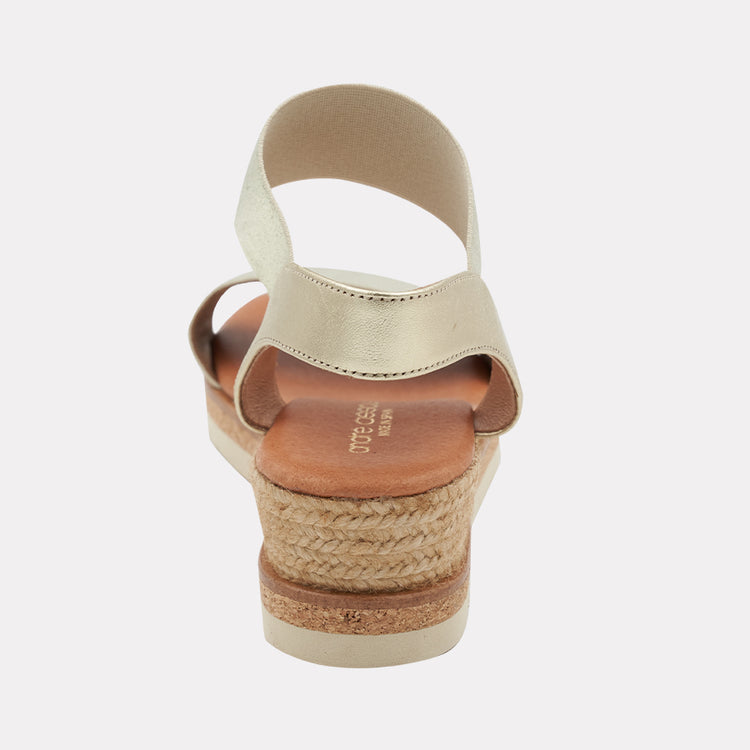Andre Assous Neveah metallic wedge shoes with stylish strap design and open toe, perfect for casual or dressy summer outfits.