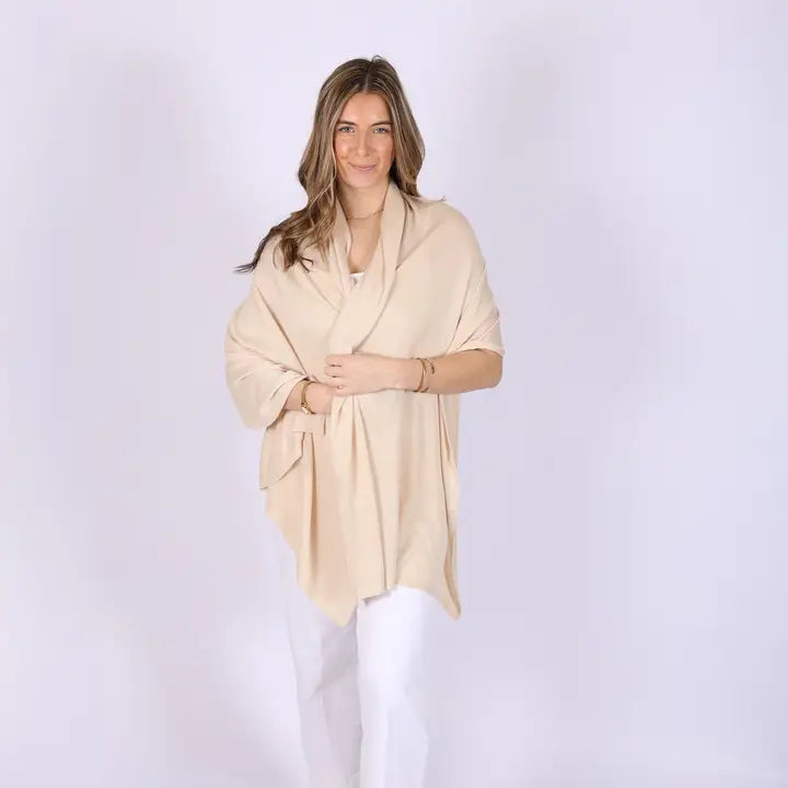 Woman wearing a beige poncho