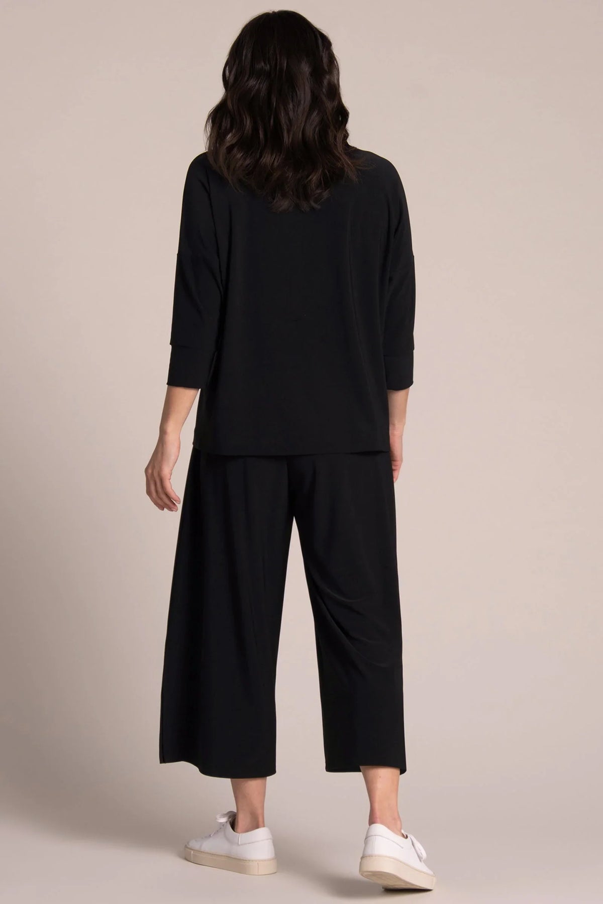 Black SYMPLI slouch sweatshirt, relaxed fit top with a cozy, oversized design, shown on a model.