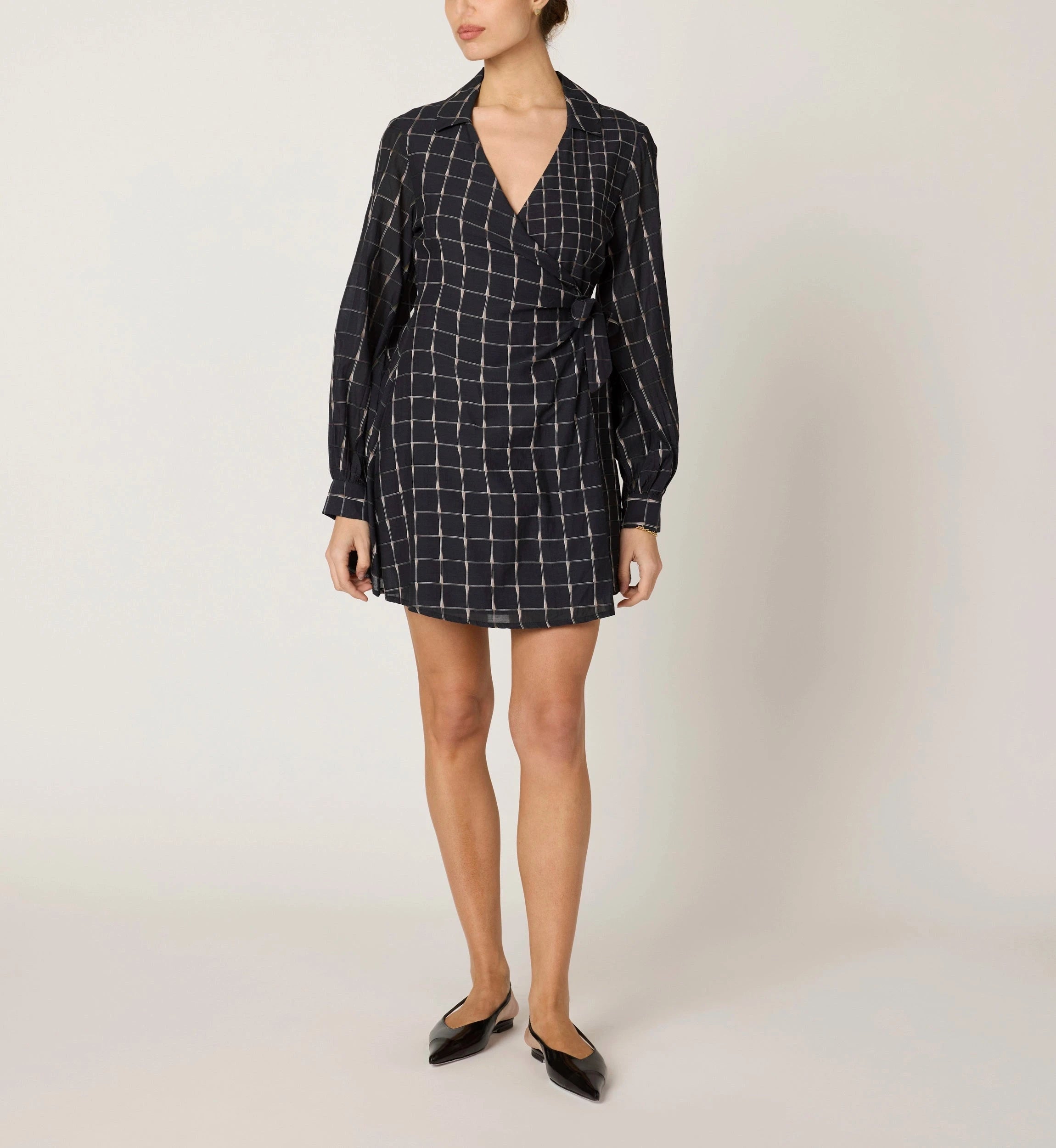 Talia Mini Dress by CLEOBELLA featuring a flowy silhouette, lightweight fabric, and boho-inspired design, shown on a hanger.