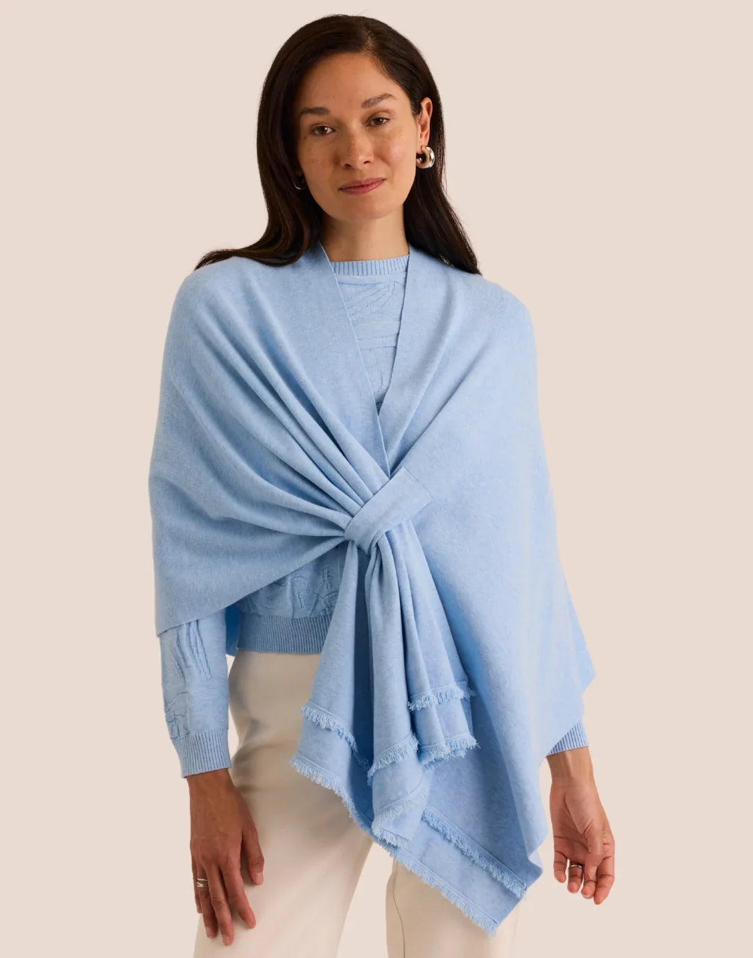 Woman wearing a light blue poncho the h edition Mabel Tab Fringe Wrap