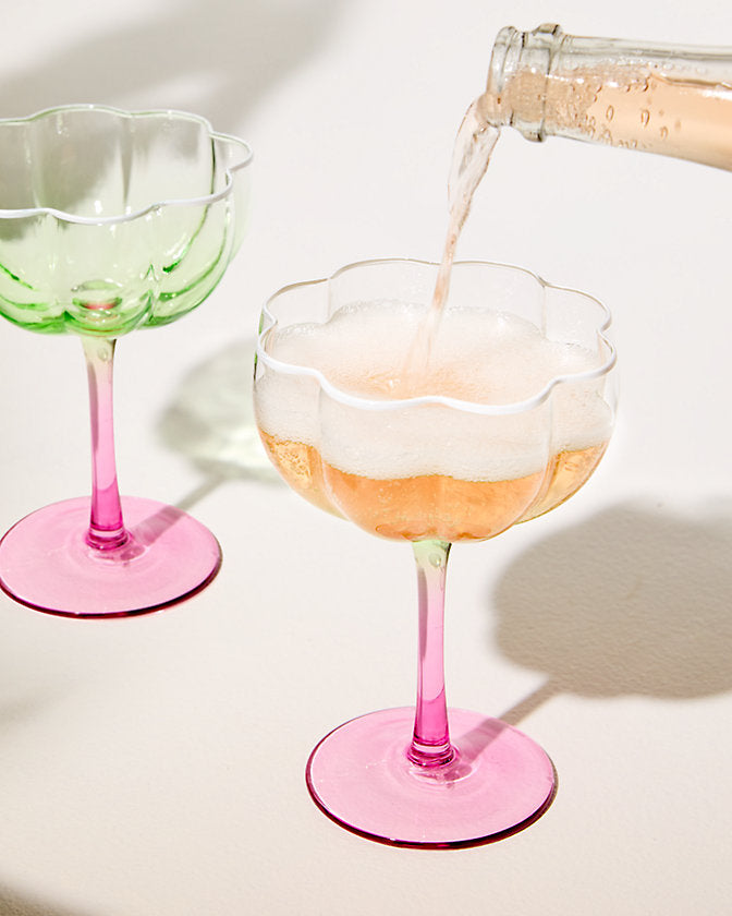 Lifeguard Press jade pink coupe glass set featuring elegant, rounded glasses with smooth curves and a glossy finish.