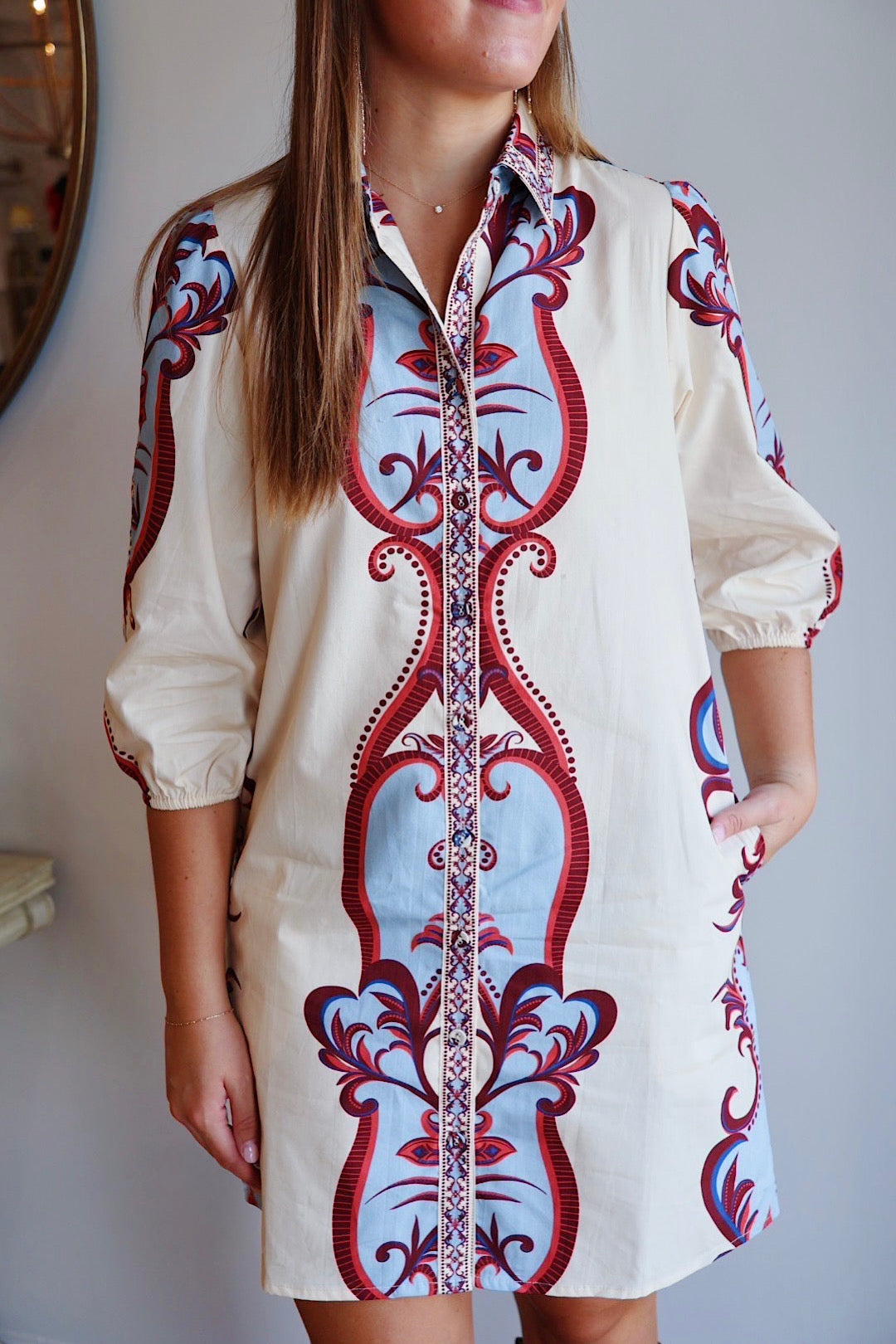 Maude Ava Dress displayed on a hanger, showcasing its stylish design and fabric details. Perfect for casual or semi-formal wear.