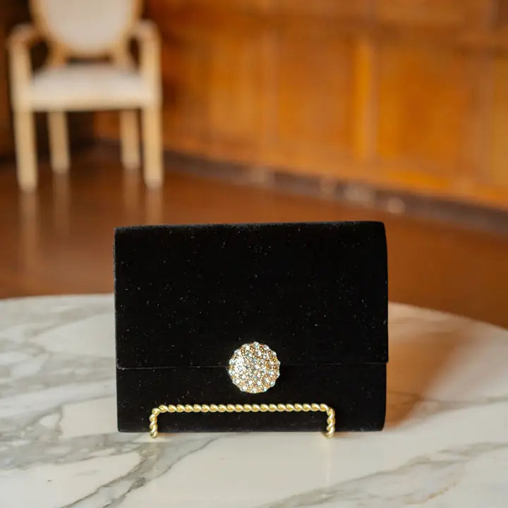 LISI LERCH black cami clutch handbag with sleek design and minimal detailing, perfect for evening or formal occasions.