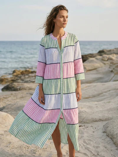 VILAGALLO multicolored stripe RESORT dress with flowing fabric and vibrant pattern, perfect for warm-weather occasions.