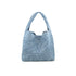 Light denim BC HANDBAGS handbag with shoulder strap and top zipper closure, stylish accessory for everyday use.
