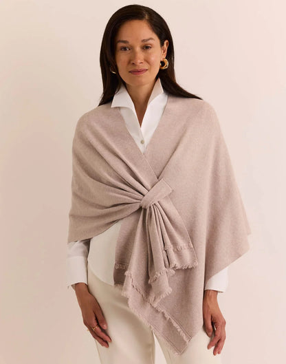 Woman wearing a beige shawl the h edition Mabel Tab Fringe Wrap stone heather