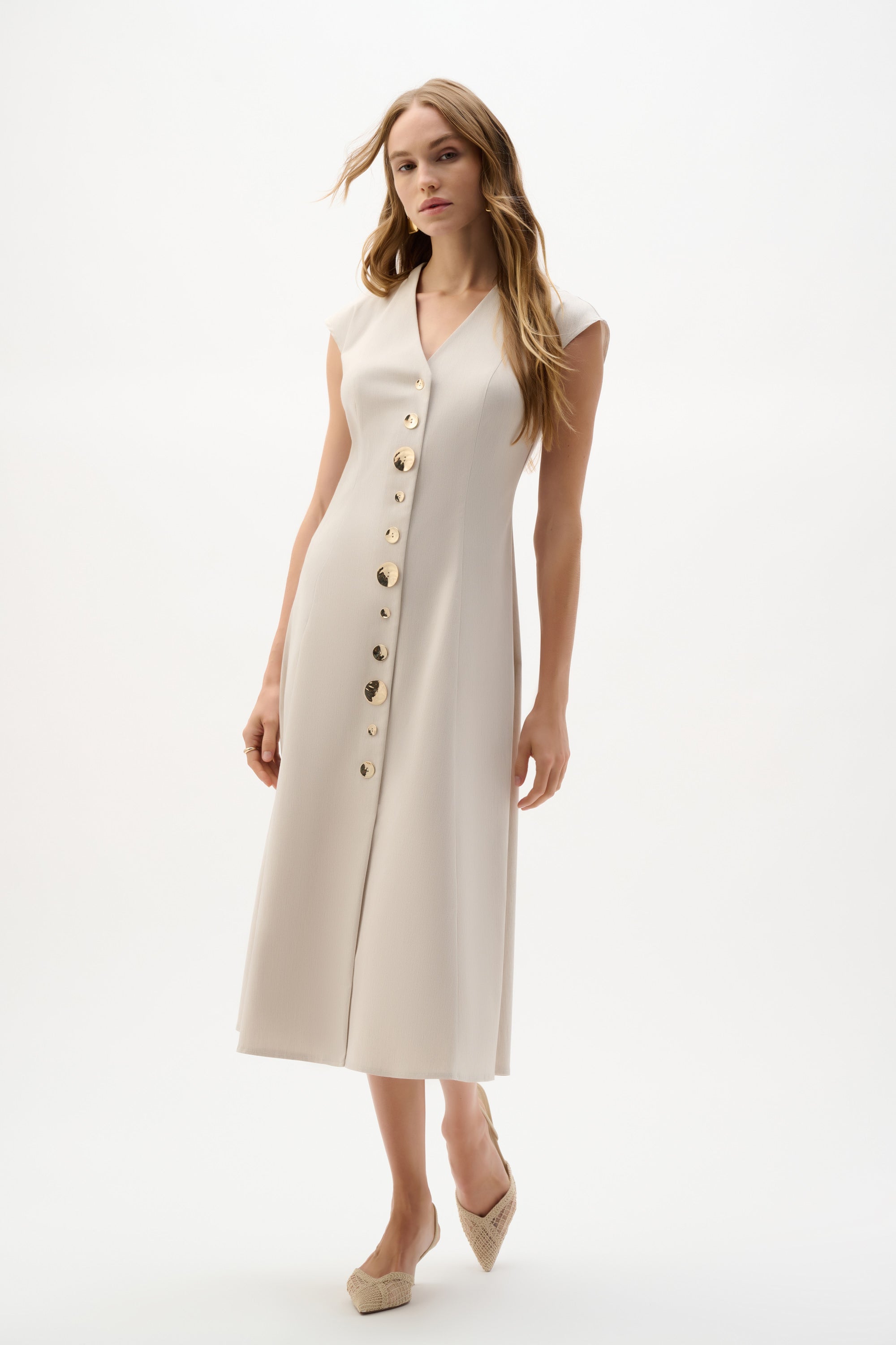 Sleeveless fit and flare dress by Joseph Ribkoff, with a flattering silhouette and stylish design, shown in the image.