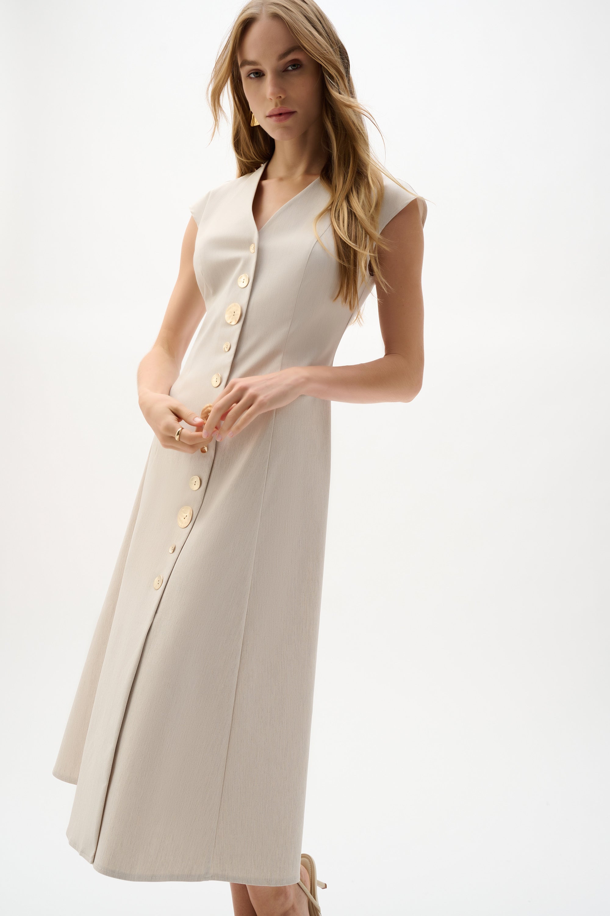 Joseph Ribkoff sleeveless fit and flare dress in vibrant fabric, featuring a flattering silhouette and elegant design.