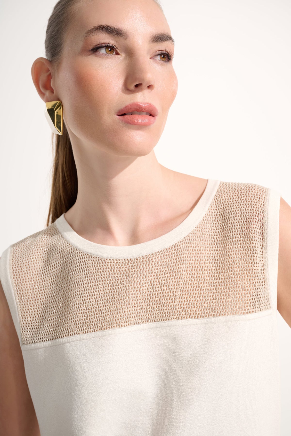 Joseph Ribkoff sleeveless crew neck pullover top in a stylish, fitted design shown in the image.